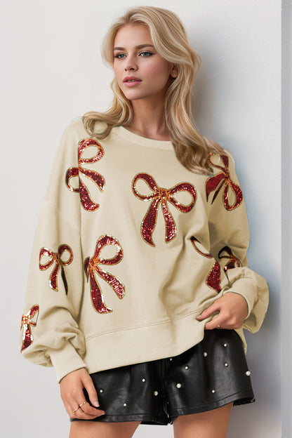 Double Take Christmas Bow Sequin Round Neck Dropped Shoulder Sweatshirt - Folded Express