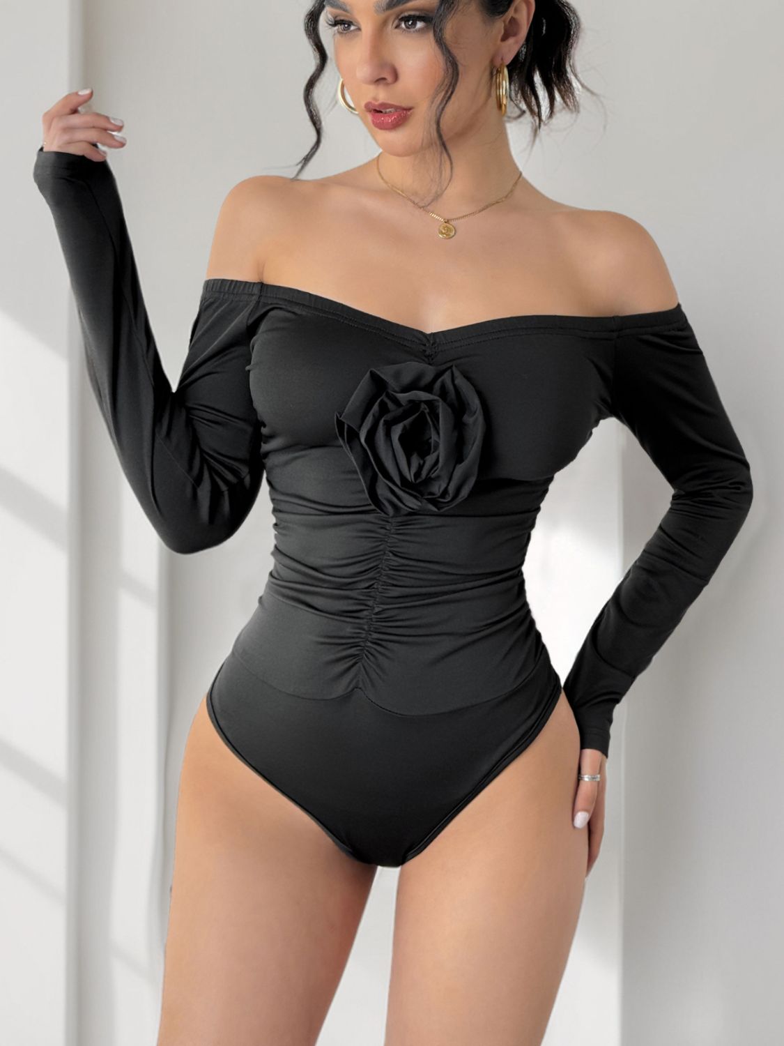 Perfee Ruched Flower Off-Shoulder Long Sleeve Bodysuit - Folded Express