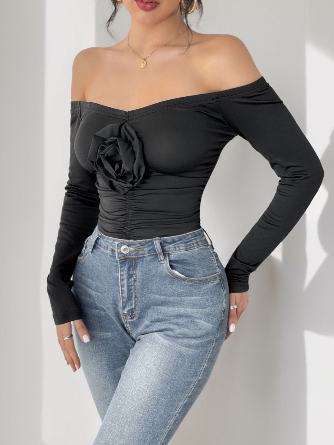 Perfee Ruched Flower Off-Shoulder Long Sleeve Bodysuit - Folded Express